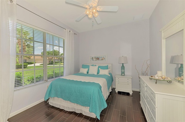 2692 Wax Myrtle Ct, Port Charlotte, FL 33953 - bedroom featuring baseboards, wood tiled floors, and a ceiling fan