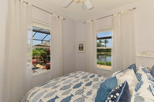 2692 Wax Myrtle Ct, Port Charlotte, FL 33953 - bedroom with access to exterior, a water view, and a ceiling fan