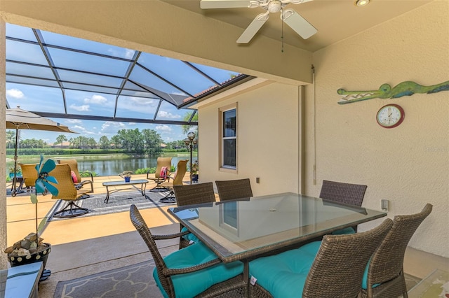 2692 Wax Myrtle Ct, Port Charlotte, FL 33953 - view of patio / terrace with a water view, a ceiling fan, glass enclosure, and outdoor dining space