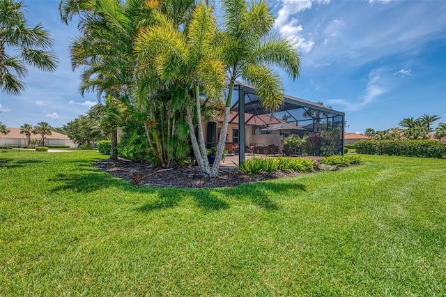 2692 Wax Myrtle Ct, Port Charlotte, FL 33953 - view of grassy yard featuring glass enclosure