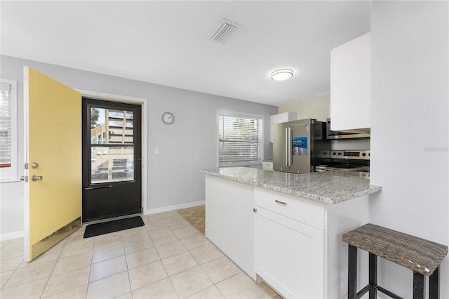 5041 N Beach Road 2A And 2B, Englewood, FL 34223 - kitchen featuring appliances with stainless steel finishes, white cabinetry, a peninsula, and baseboards