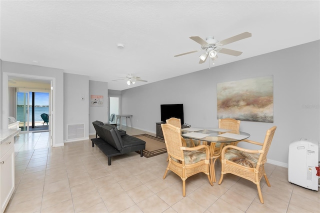 5041 N Beach Road 2A And 2B, Englewood, FL 34223 - dining area with a ceiling fan, light tile patterned floors, and baseboards