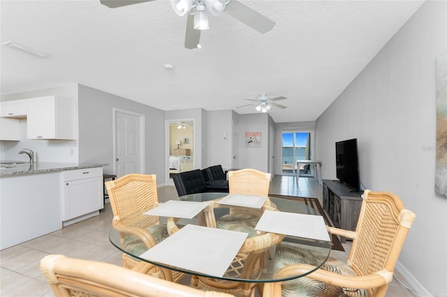 5041 N Beach Road 2A And 2B, Englewood, FL 34223 - dining area featuring ceiling fan and light tile patterned floors