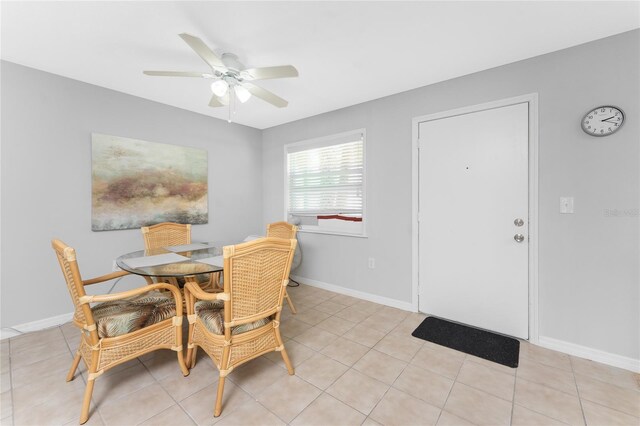 5041 N Beach Road 2A And 2B, Englewood, FL 34223 - dining room with a ceiling fan, light tile patterned flooring, and baseboards