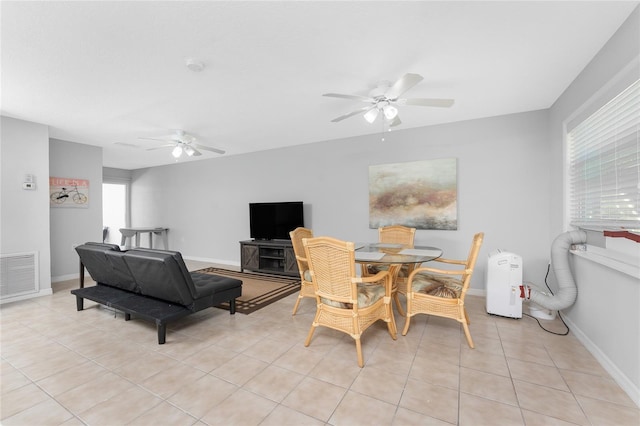 5041 N Beach Road 2A And 2B, Englewood, FL 34223 - dining room with a ceiling fan, light tile patterned floors, and baseboards