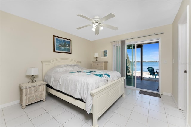 5041 N Beach Road 2A And 2B, Englewood, FL 34223 - bedroom with access to exterior, a water view, baseboards, light tile patterned flooring, and ceiling fan