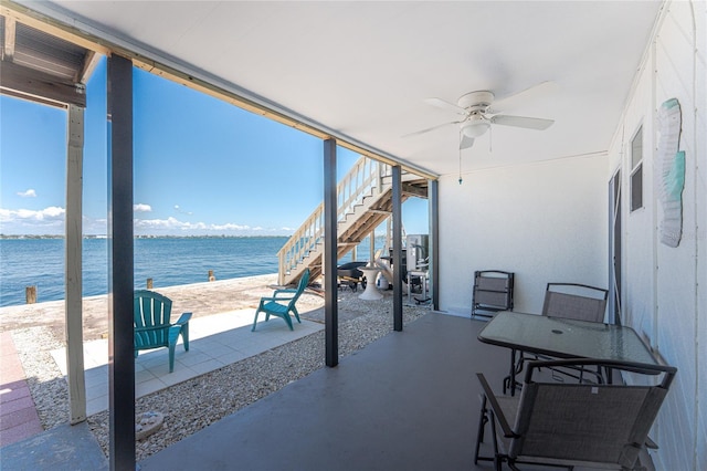 5041 N Beach Road 2A And 2B, Englewood, FL 34223 - unfurnished sunroom featuring ceiling fan and a water view