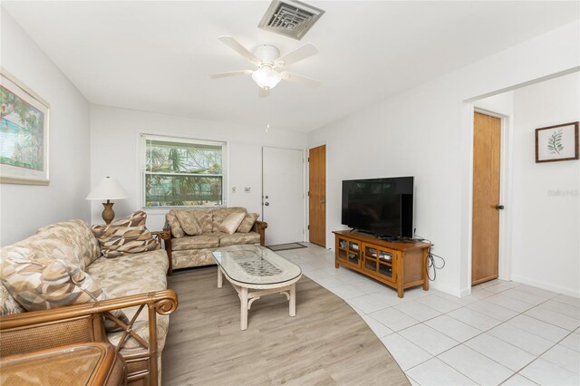 5041 N Beach Road 2A And 2B, Englewood, FL 34223 - living room with ceiling fan, light wood finished floors, and baseboards