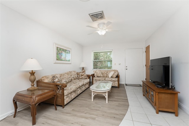 5041 N Beach Road 2A And 2B, Englewood, FL 34223 - living room with a ceiling fan, baseboards, and light wood-style flooring