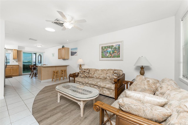 5041 N Beach Road 2A And 2B, Englewood, FL 34223 - living area with a ceiling fan, light tile patterned floors, and baseboards