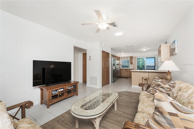 5041 N Beach Road 2A And 2B, Englewood, FL 34223 - living area featuring light tile patterned floors and a ceiling fan