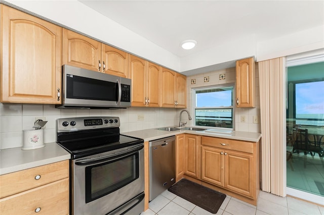 5041 N Beach Road 2A And 2B, Englewood, FL 34223 - kitchen featuring appliances with stainless steel finishes, a sink, and light countertops