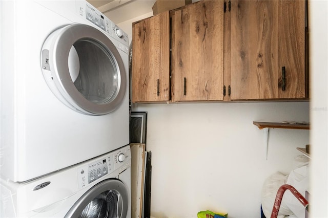 5041 N Beach Road 2A And 2B, Englewood, FL 34223 - washroom with stacked washer / dryer and cabinet space