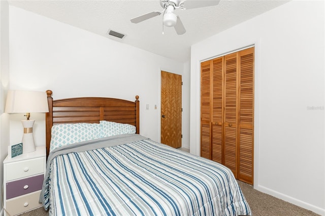 5041 N Beach Road 2A And 2B, Englewood, FL 34223 - carpeted bedroom featuring a closet, a ceiling fan, and baseboards