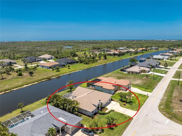 1157 Rotonda Cir, Rotonda West, FL 33947 - aerial perspective of suburban area with a large body of water