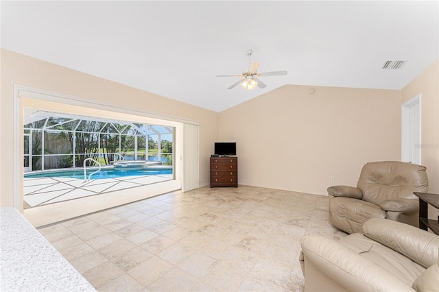 1157 Rotonda Cir, Rotonda West, FL 33947 - living room featuring a ceiling fan and lofted ceiling