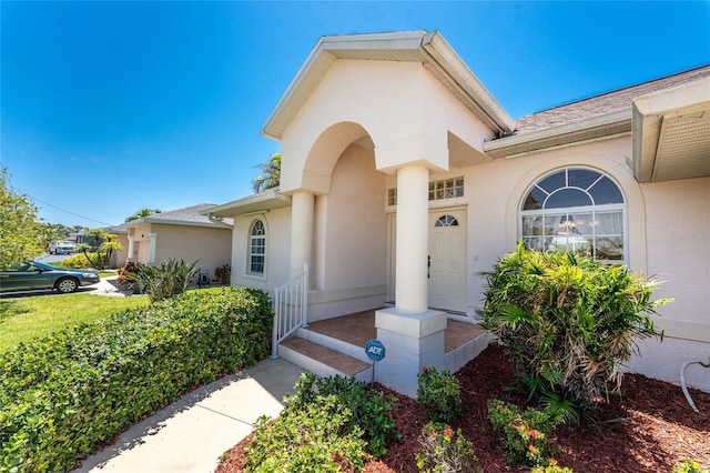 1157 Rotonda Cir, Rotonda West, FL 33947 - property entrance with stucco siding