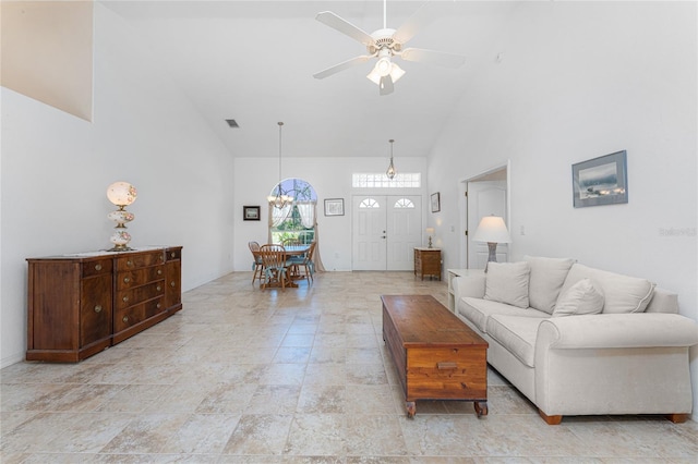 1157 Rotonda Cir, Rotonda West, FL 33947 - living area with high vaulted ceiling, a chandelier, and a ceiling fan