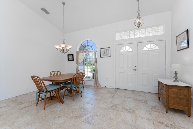 1157 Rotonda Cir, Rotonda West, FL 33947 - entrance foyer featuring high vaulted ceiling and a chandelier