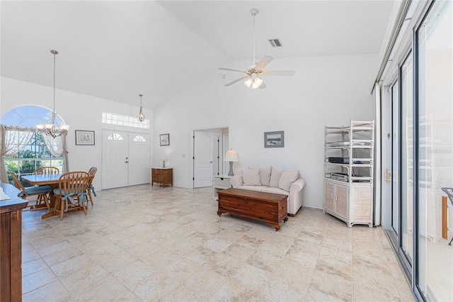 1157 Rotonda Cir, Rotonda West, FL 33947 - living room featuring high vaulted ceiling, ceiling fan, and a chandelier