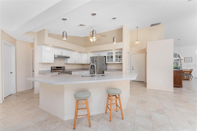 1157 Rotonda Cir, Rotonda West, FL 33947 - kitchen with appliances with stainless steel finishes, a ceiling fan, under cabinet range hood, white cabinets, and light countertops