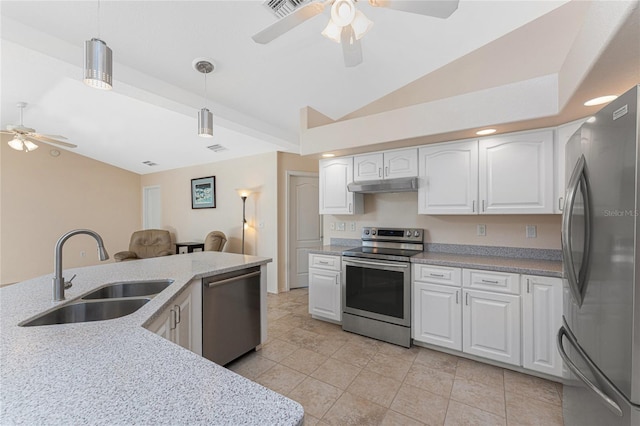 1157 Rotonda Cir, Rotonda West, FL 33947 - kitchen with stainless steel appliances, a sink, a ceiling fan, vaulted ceiling, and under cabinet range hood