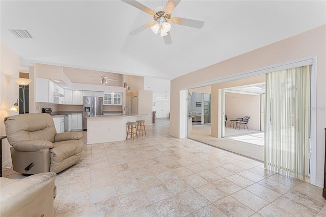 1157 Rotonda Cir, Rotonda West, FL 33947 - living room featuring ceiling fan and high vaulted ceiling