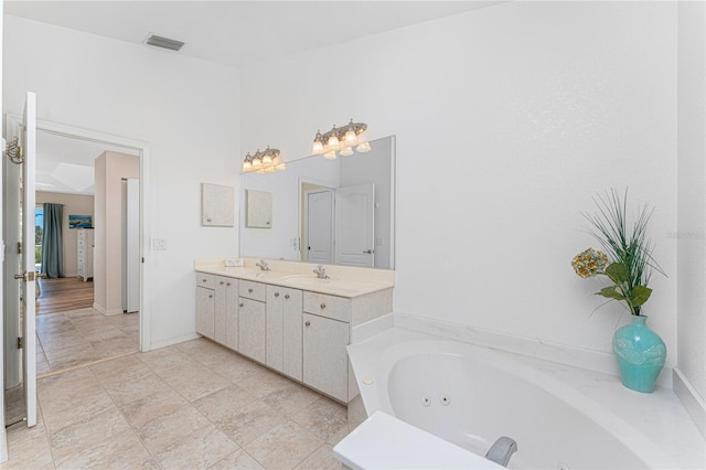1157 Rotonda Cir, Rotonda West, FL 33947 - full bath featuring double vanity, a whirlpool tub, and baseboards