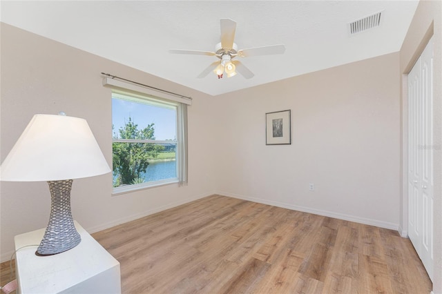 1157 Rotonda Cir, Rotonda West, FL 33947 - unfurnished bedroom with a closet, light wood-style floors, baseboards, and a ceiling fan