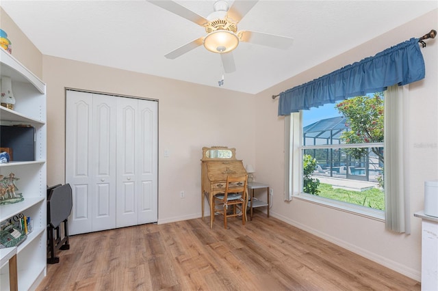 1157 Rotonda Cir, Rotonda West, FL 33947 - office space with light wood-style flooring, baseboards, and a ceiling fan