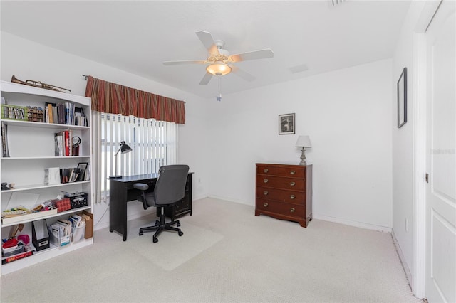 1157 Rotonda Cir, Rotonda West, FL 33947 - office with light colored carpet, ceiling fan, and baseboards