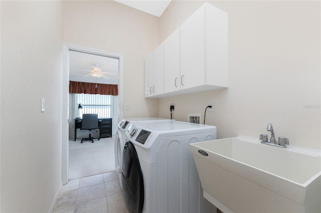 1157 Rotonda Cir, Rotonda West, FL 33947 - laundry area featuring cabinet space, washer and clothes dryer, a desk, ceiling fan, and light carpet