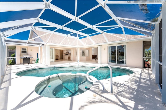 1157 Rotonda Cir, Rotonda West, FL 33947 - view of swimming pool featuring a patio area, a pool with connected hot tub, and glass enclosure