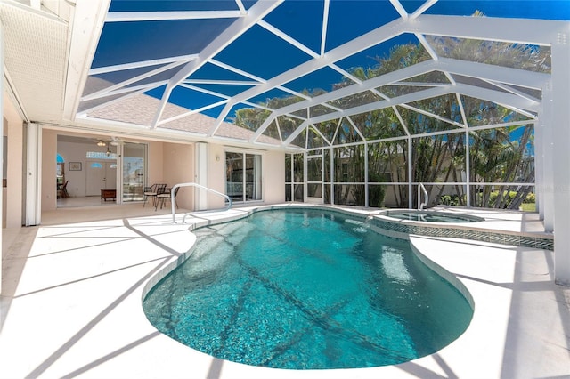 1157 Rotonda Cir, Rotonda West, FL 33947 - view of swimming pool featuring a patio, a pool with connected hot tub, and glass enclosure