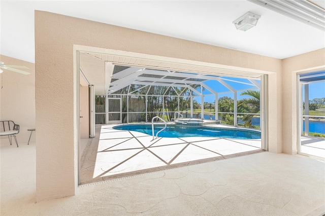 1157 Rotonda Cir, Rotonda West, FL 33947 - view of swimming pool featuring a patio area, ceiling fan, a water view, a pool with connected hot tub, and a lanai
