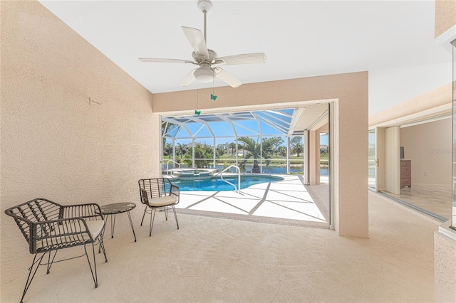 1157 Rotonda Cir, Rotonda West, FL 33947 - view of swimming pool with a ceiling fan, a patio area, a pool with connected hot tub, glass enclosure, and a water view