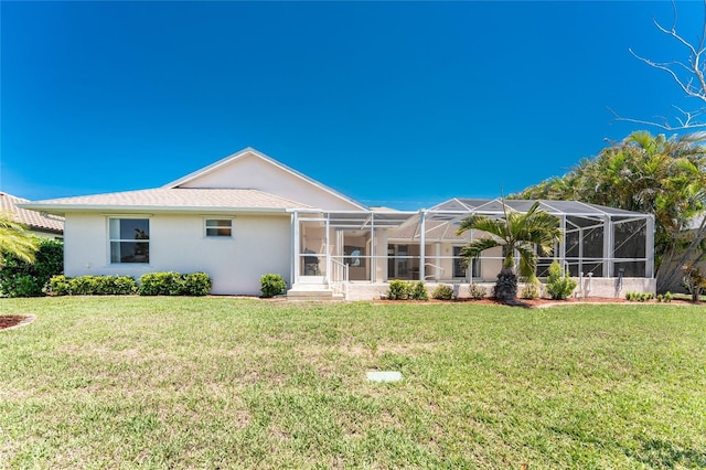 1157 Rotonda Cir, Rotonda West, FL 33947 - rear view of property with stucco siding, a yard, and a lanai