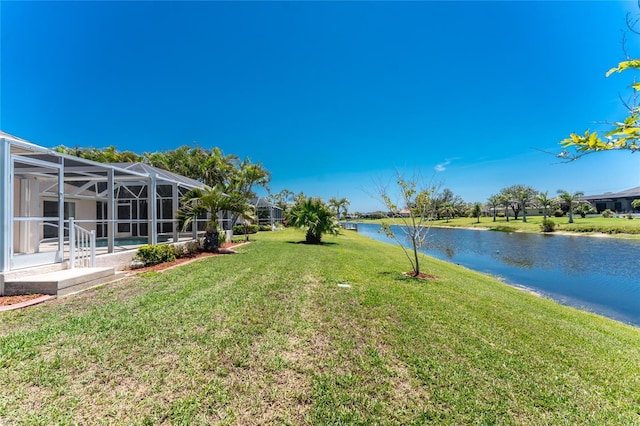 1157 Rotonda Cir, Rotonda West, FL 33947 - view of green lawn featuring a water view and glass enclosure