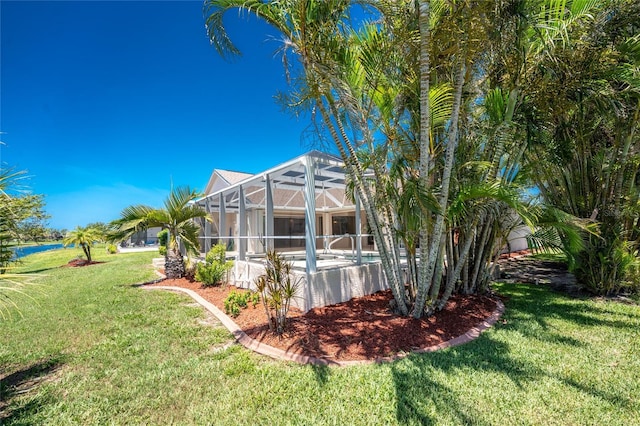 1157 Rotonda Cir, Rotonda West, FL 33947 - back of property with a yard, an outdoor pool, and a lanai