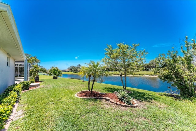 1157 Rotonda Cir, Rotonda West, FL 33947 - view of grassy yard with a water view