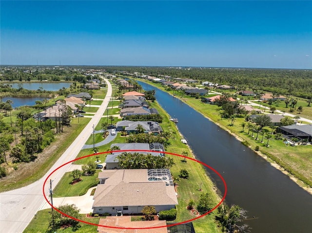 1157 Rotonda Cir, Rotonda West, FL 33947 - aerial view of residential area with a large body of water
