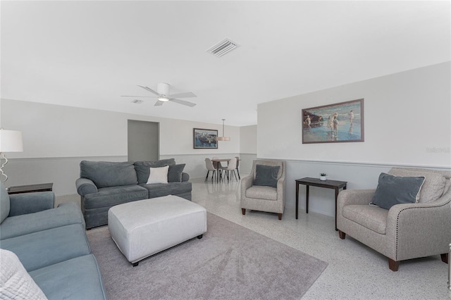 1691 Lakeview Pl, Englewood, FL 34223 - living area with speckle patterned floor and a ceiling fan