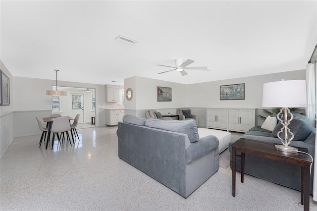 1691 Lakeview Pl, Englewood, FL 34223 - living room with dark speckled floor and a ceiling fan