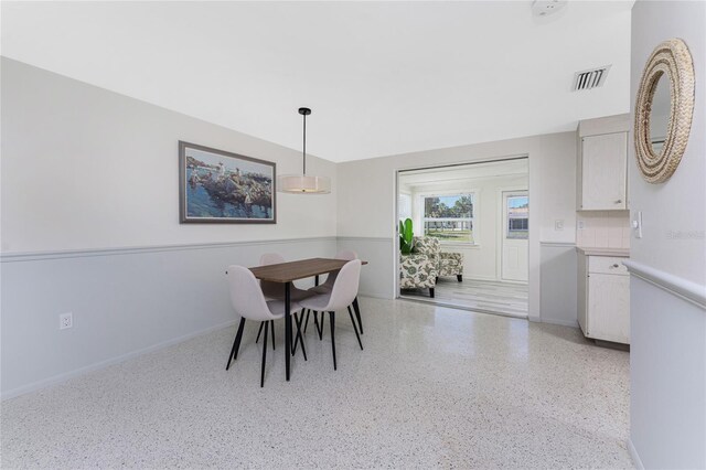 1691 Lakeview Pl, Englewood, FL 34223 - dining room featuring speckled floor and baseboards