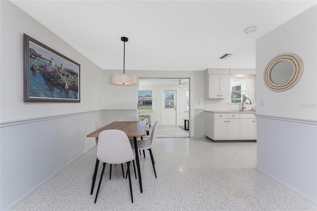 1691 Lakeview Pl, Englewood, FL 34223 - dining room with baseboards and dark speckled floor