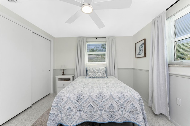 1691 Lakeview Pl, Englewood, FL 34223 - bedroom with speckled floor, a ceiling fan, and a closet