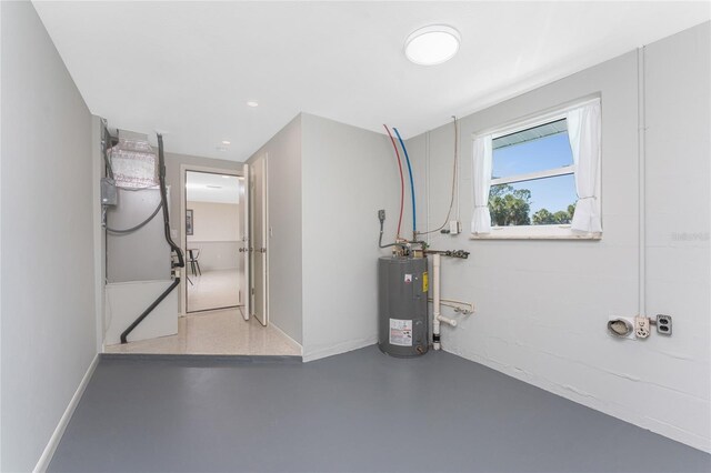 1691 Lakeview Pl, Englewood, FL 34223 - basement featuring water heater, baseboards, and recessed lighting