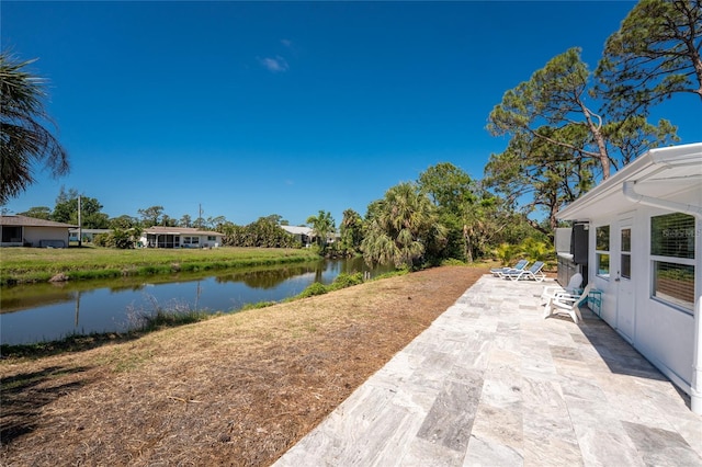 1691 Lakeview Pl, Englewood, FL 34223 - view of yard with a water view and a patio