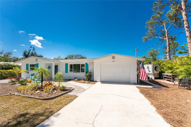 1691 Lakeview Pl, Englewood, FL 34223 - single story home featuring a garage, concrete driveway, and stucco siding