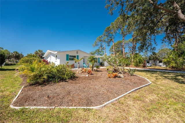 1691 Lakeview Pl, Englewood, FL 34223 - view of front facade with a front lawn